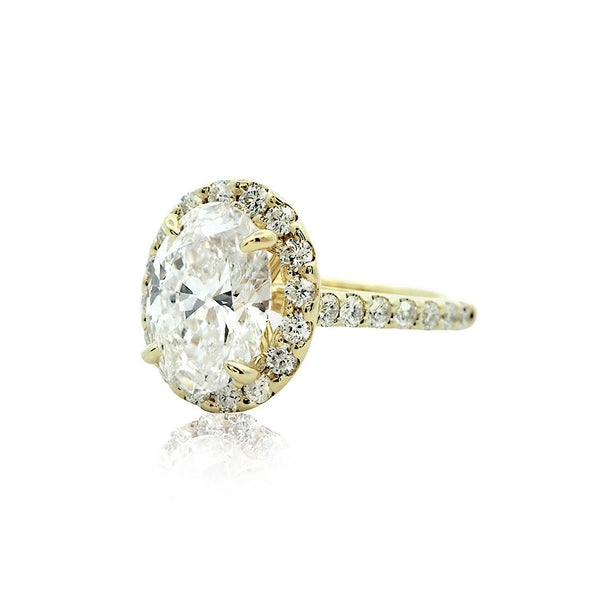 2 ct Oval Lab-Grown Diamond on a 18k yellow gold halo side-diamond engagement ring