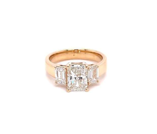 three-stone-radiant-cut-emerald-accent-diamond-engagement-ring-fame-diamonds