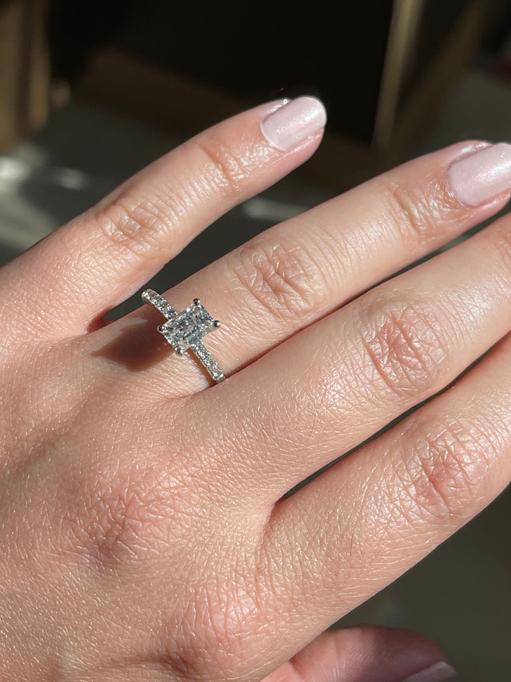 Modern Emerald Cut Solitaire Side-Diamond Engagement Ring