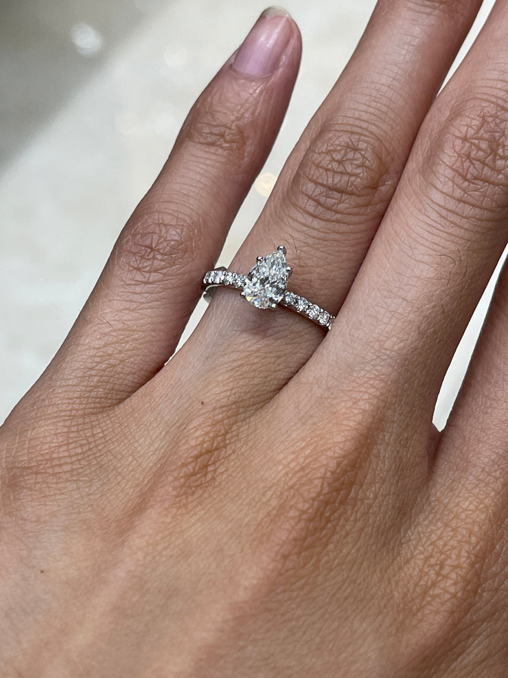 18k-white-gold-pear-shape-solitaire-side-diamond-engagement-ring-fame-diamonds