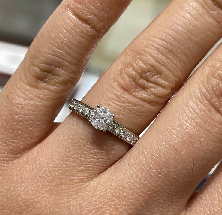 4-Prong Solitaire Channel-Set Side-Stone Diamond Engagement Ring