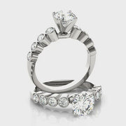 round-brilliant-cut-with-bezel-set-diamond-modern-white-gold-engagement-ring-fame-diamonds