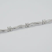CR-B52530 - 10K White Gold 1.21ctw Canadian Diamond Twisted Tennis Bracelet