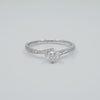 Round-brilliant-solitaire-side-diamond-fancy-engagement-ring-famediamonds